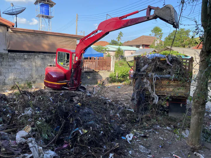 Loading construction debris into a dump truck