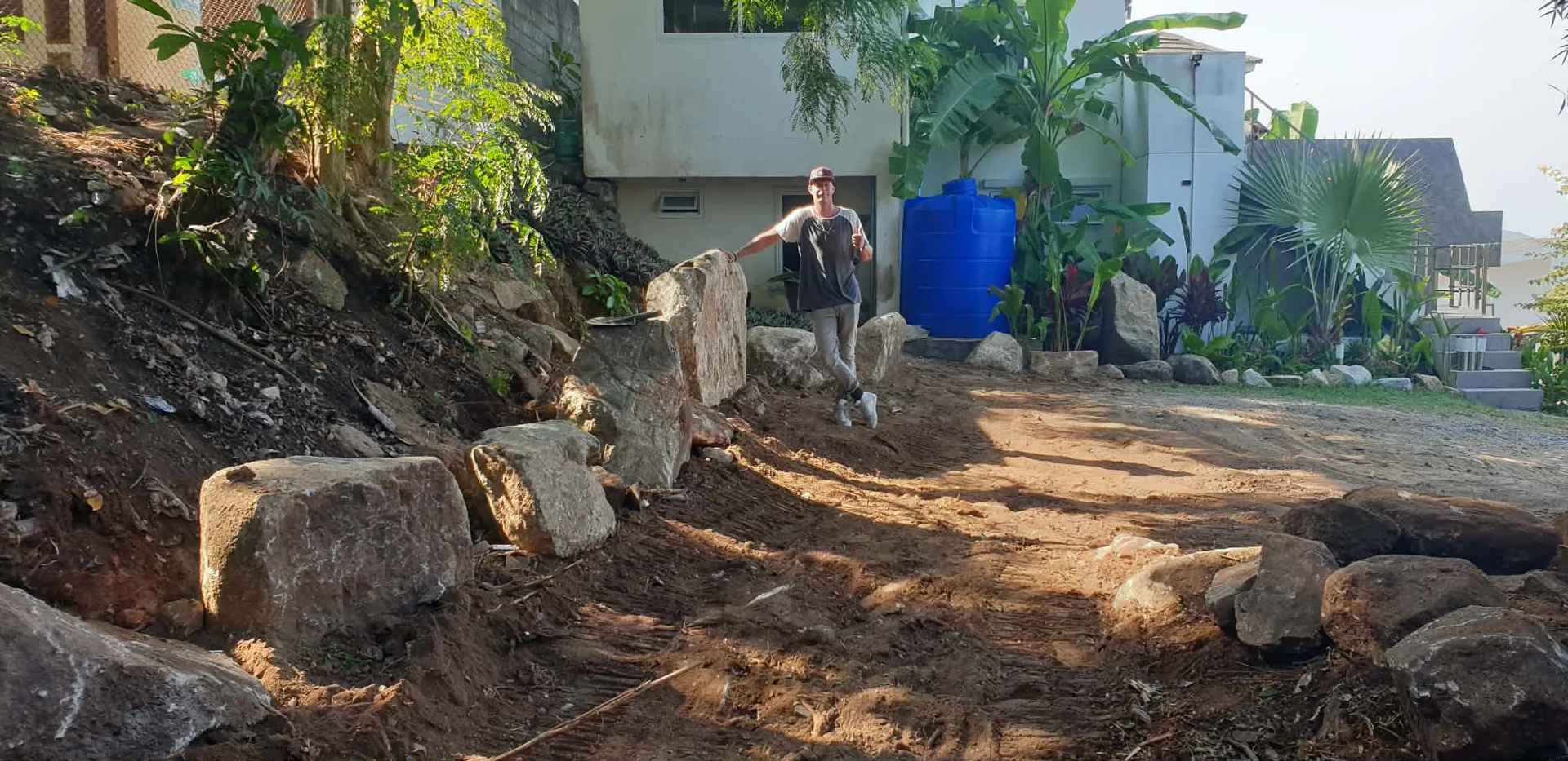 Stone relocation and path clearance to a waterfall in Chaweng hills