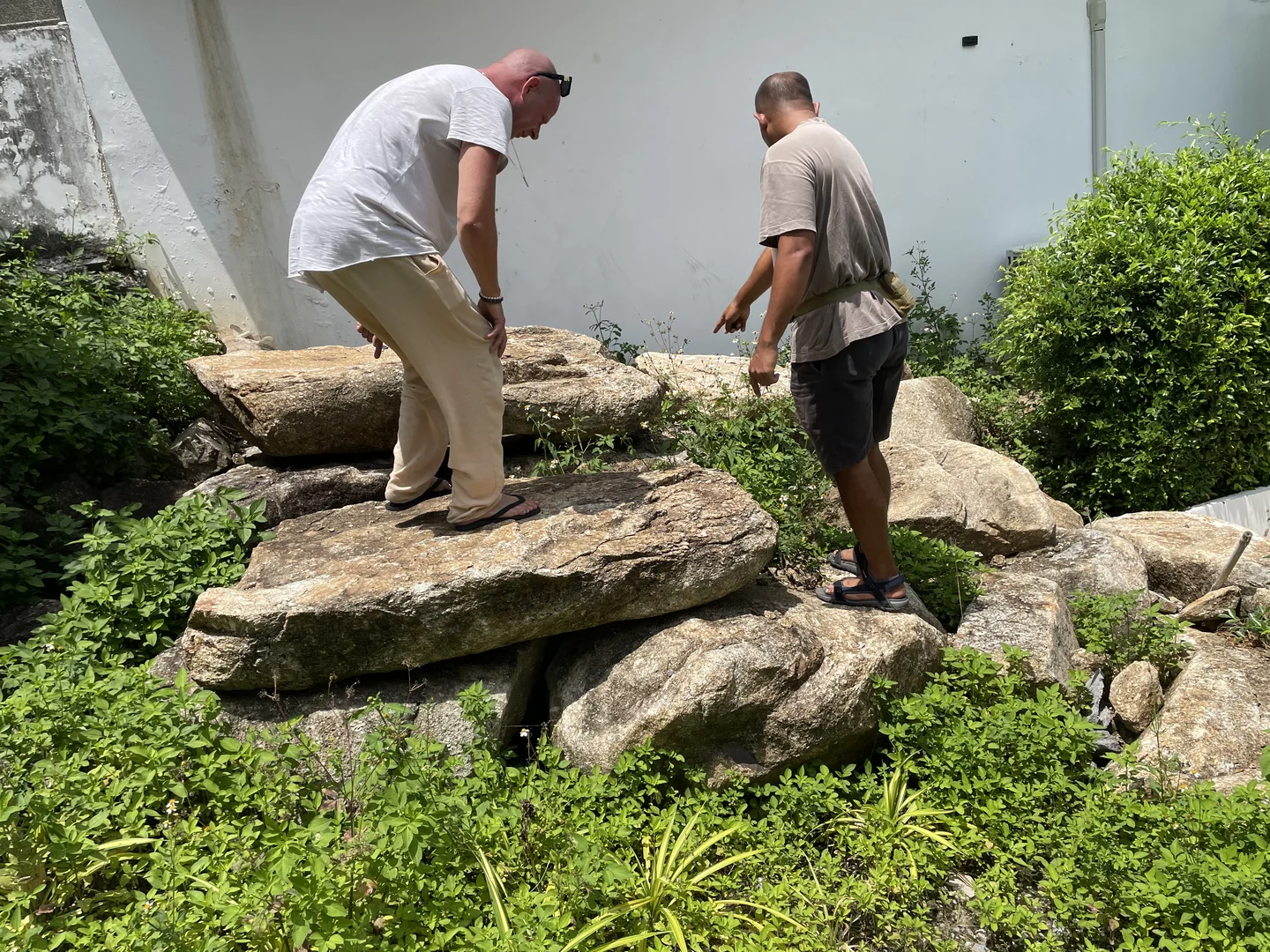 Selecting and reviewing large stones to be used in the waterfall composition