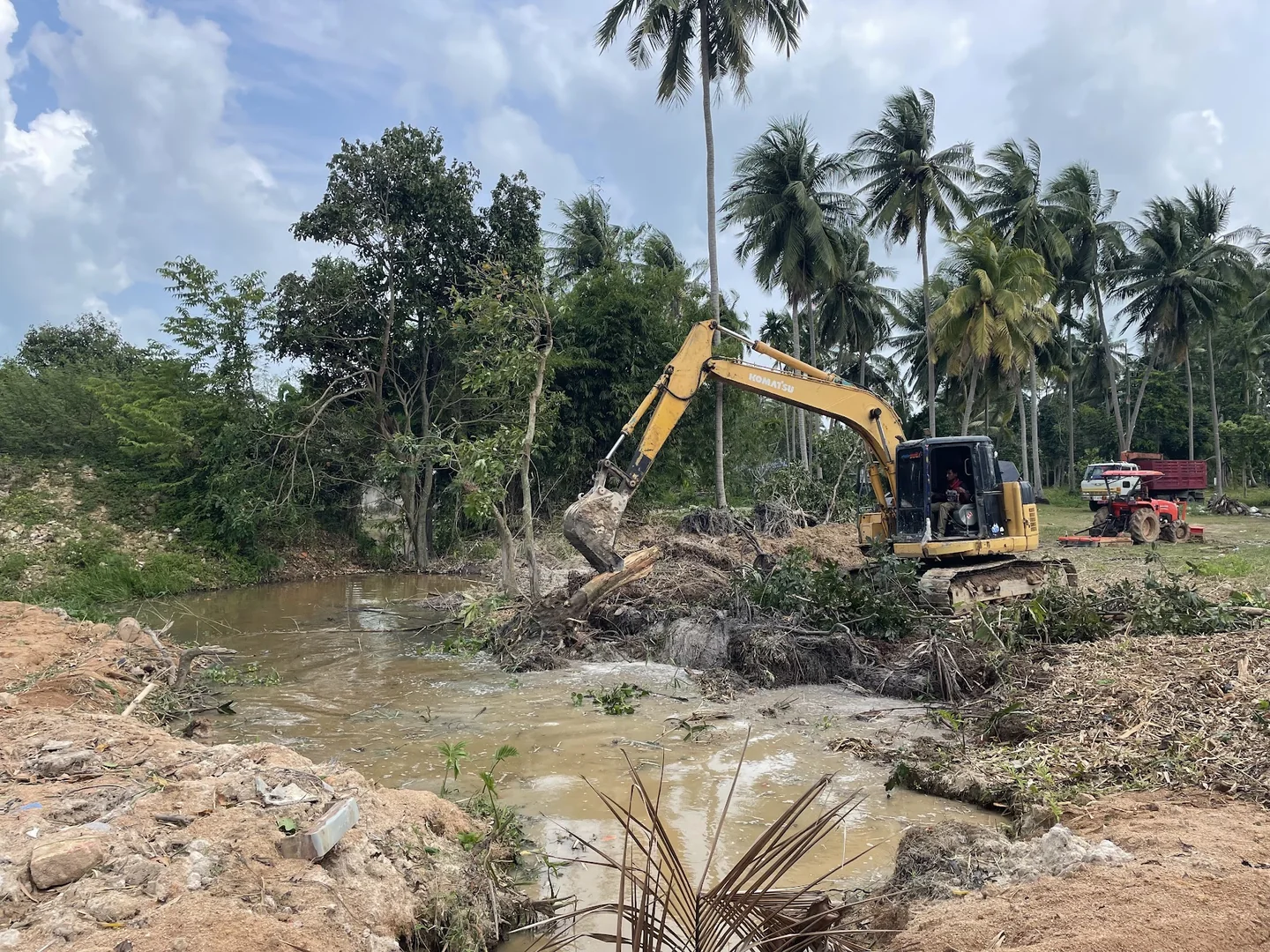 Clearing and deepening the drainage channel to open the natural watercourse