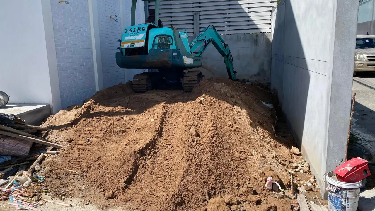 Backfilling the installed septic tank with soil