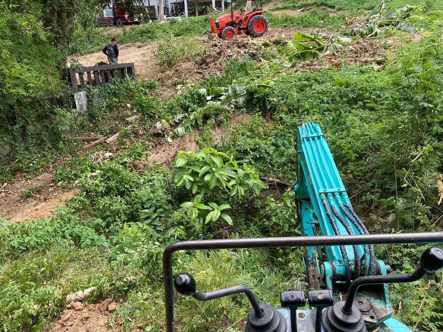 View from the excavator cab during active site clearance