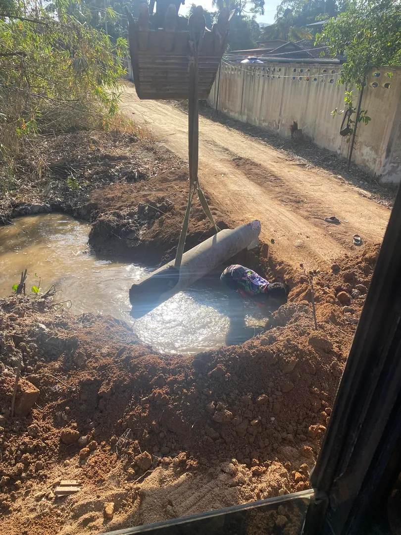 Installing drainage pipe under an access road