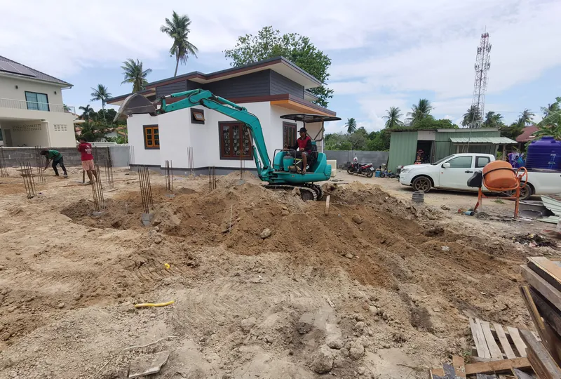 Earthworks with a mini excavator in limited-access areas