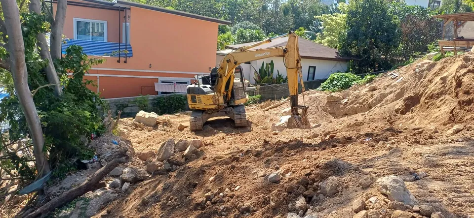 Excavation works, digging and moving soil with excavator