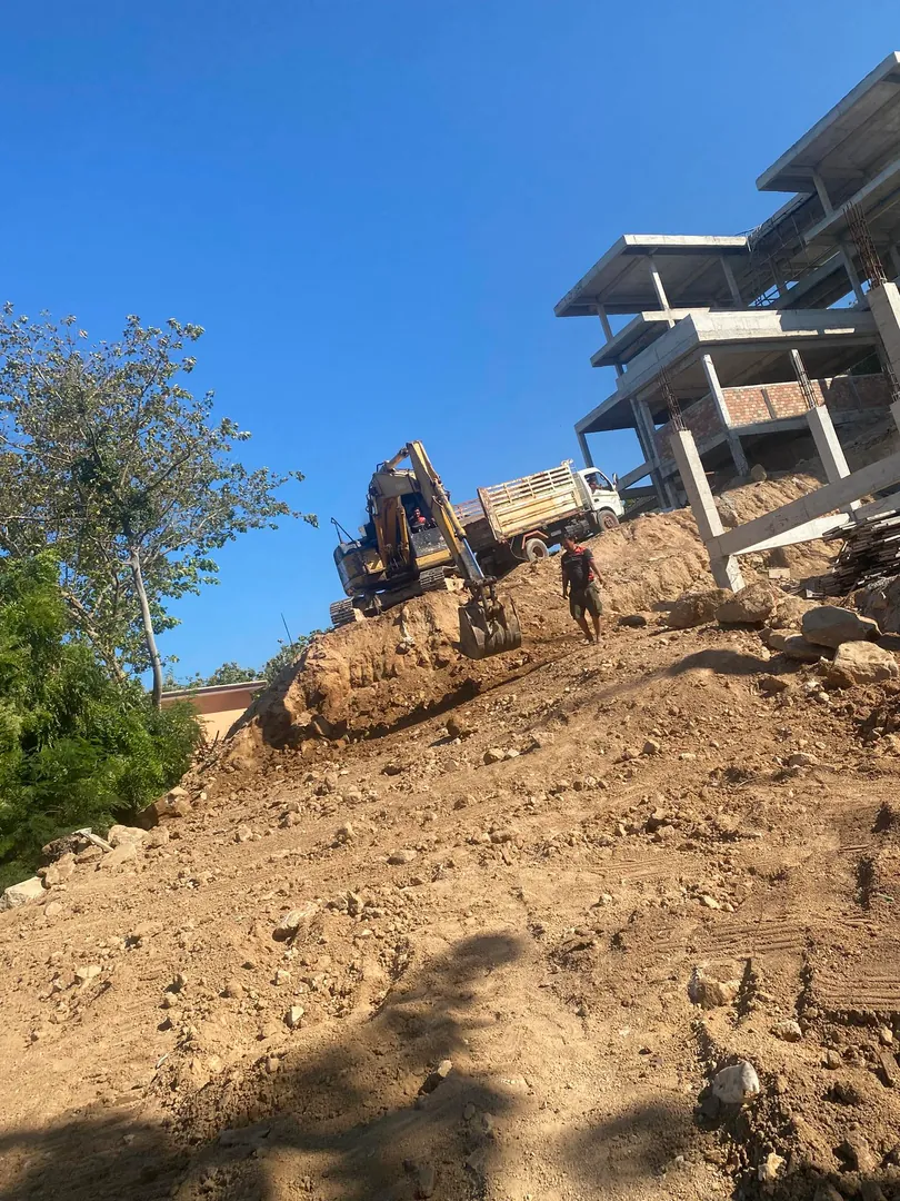 Shaping land slopes for water runoff