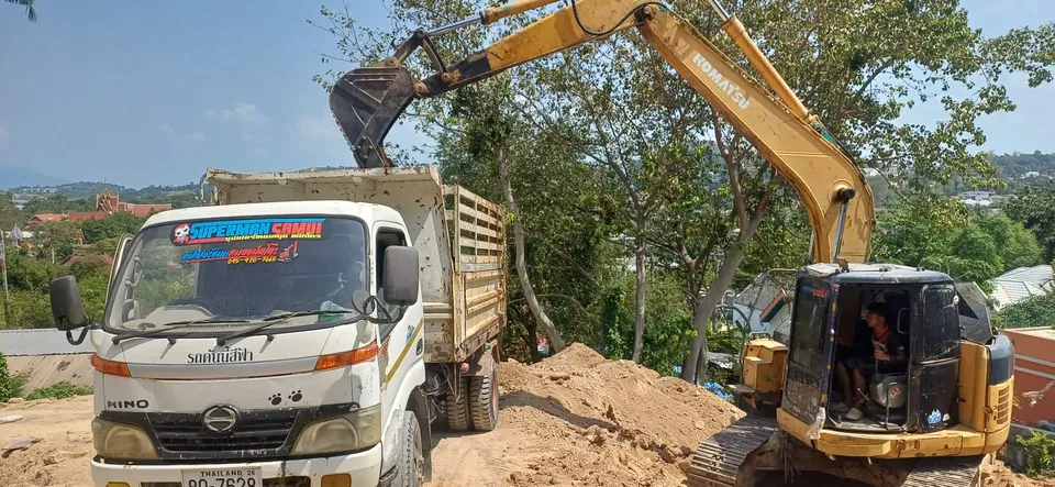 Loading soil and bulk materials into a truck for removal