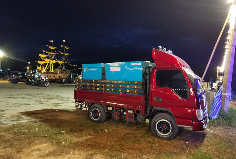 Transporting a generator by truck to a temporary work site